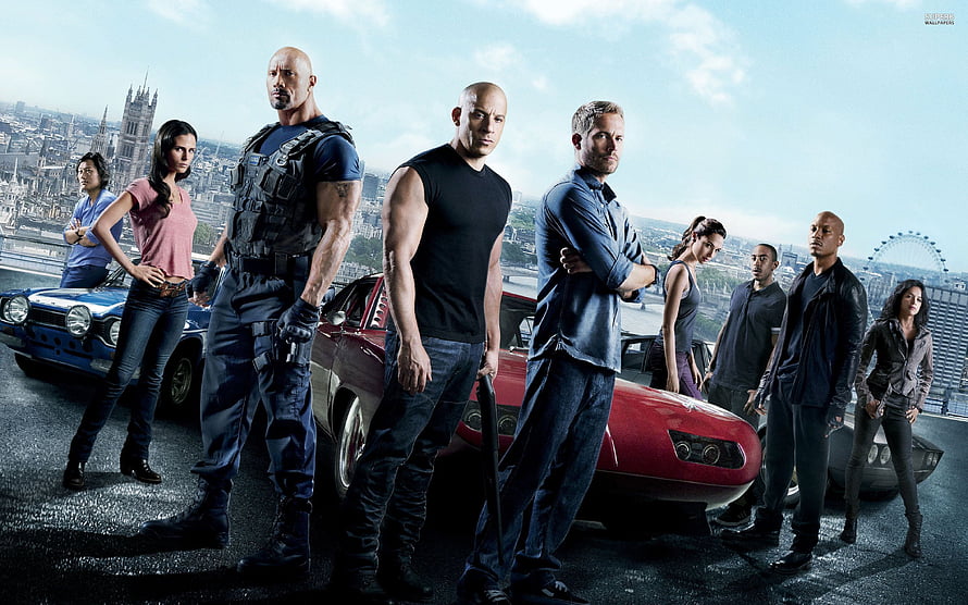 Fast and Furious Cast Standing in Front of Classic Muscle Cars in London HD wallpaper