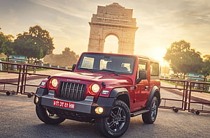 Red Mahindra Thar SUV Parked in Front of India Gate at Golden Hour HD wallpaper