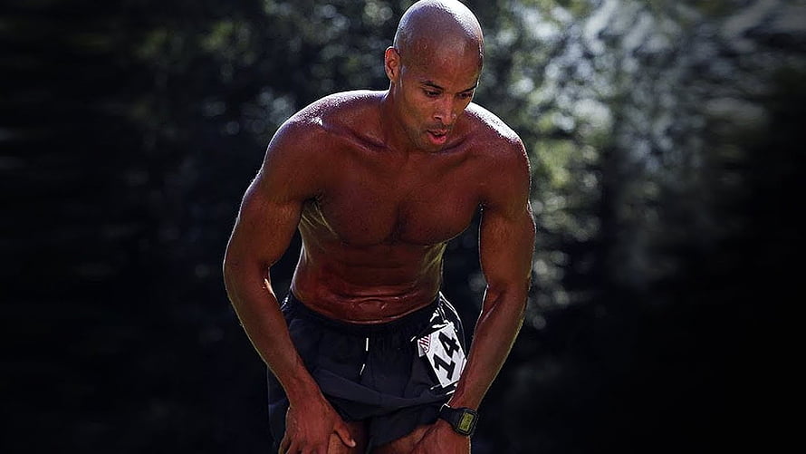 David Goggins shirtless during intense outdoor endurance training in the forest HD wallpaper
