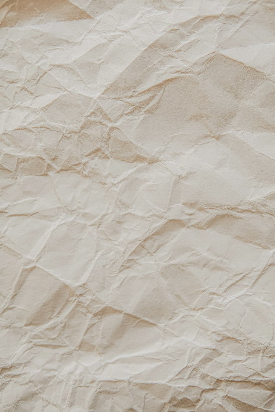 Crumpled Beige Paper Texture with Soft Folds and Natural Creases HD phone wallpaper