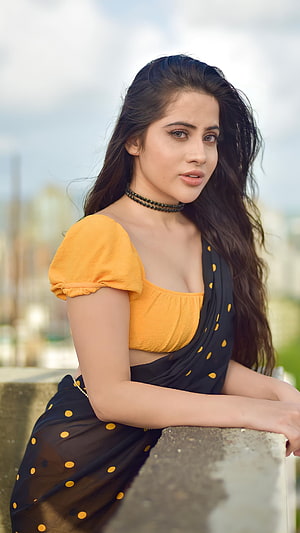 Urfi Javed in a yellow blouse and black polka dot saree with a choker necklace HD phone wallpaper