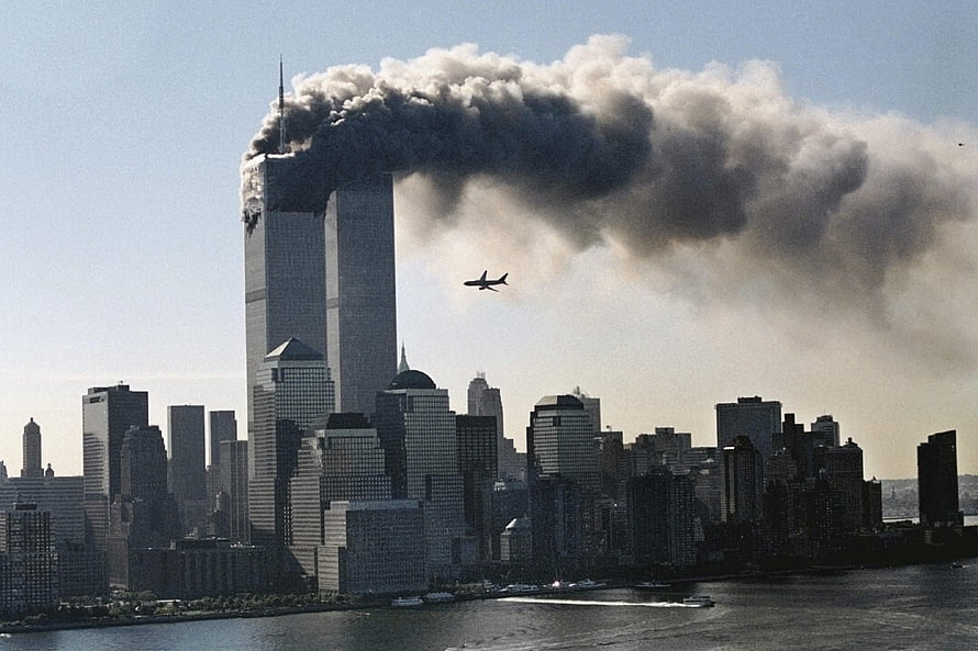 New York City skyline with smoke rising from a skyscraper and an airplane in flight HD wallpaper