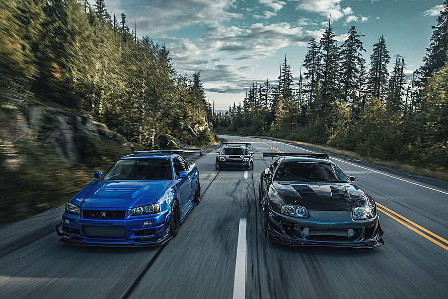 JDM Legends: Nissan GT-R R34, Toyota Supra, and Acura NSX Racing on a Forest Road HD wallpaper