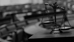 Black and White Scales of Justice in a Courtroom Setting HD wallpaper