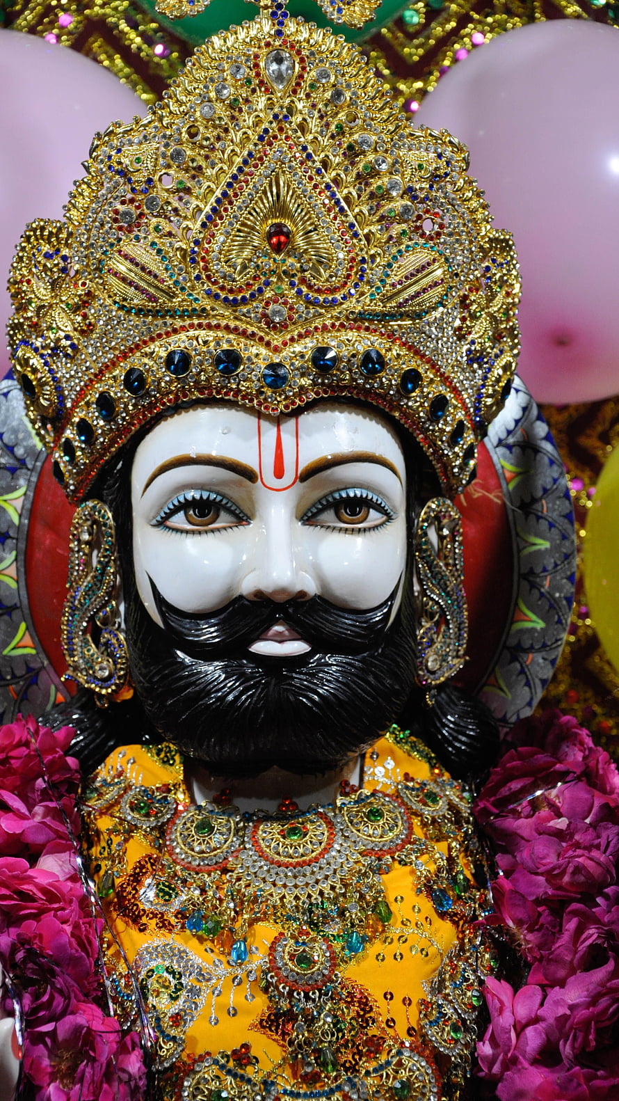 Khatu Shyam Ji Murti with Ornate Golden Crown and Vibrant Floral Garland HD phone wallpaper