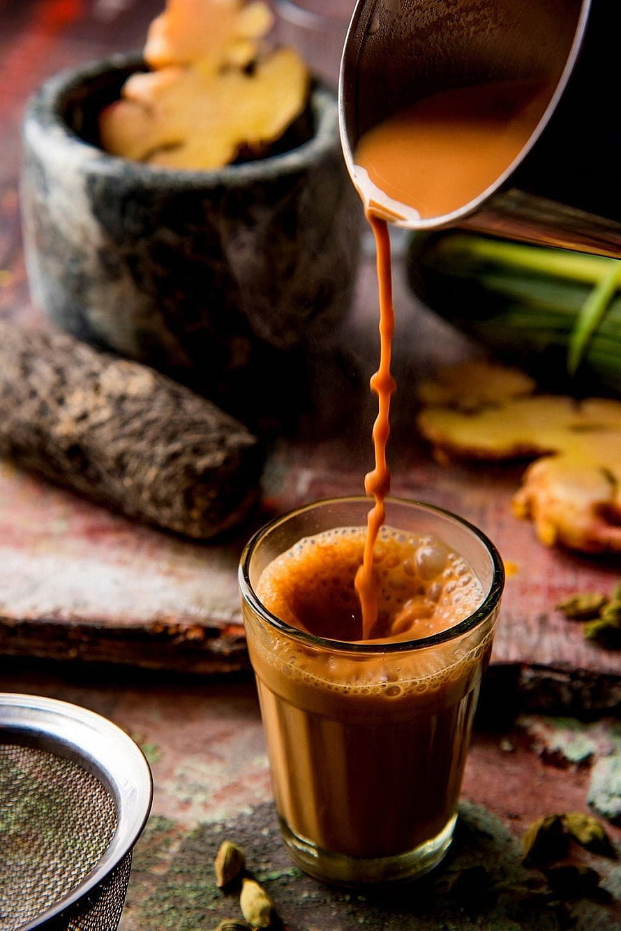 Pouring Spiced Masala Chai Into Glass With Fresh Ginger And Cardamom HD phone wallpaper