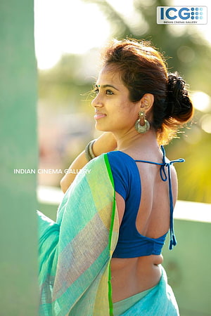 Ramya Pandian in a Blue and Green Saree with Traditional Gold Earrings HD phone wallpaper