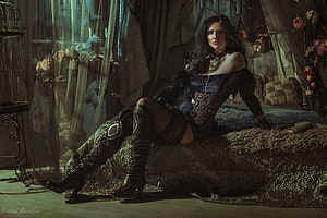 Yennefer from The Witcher in a dark gothic bedroom with leather boots and corset HD wallpaper