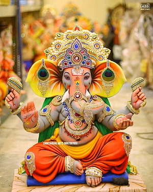 Ornate Ganesha Murti with Jeweled Crown and Four Arms in Traditional Indian Style HD phone wallpaper