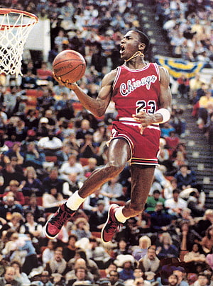 Michael Jordan Chicago Bulls Number 23 Mid-Air Dunk Action Shot HD phone wallpaper