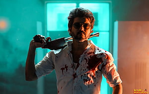 Thalapathy Vijay in BEAST movie still with sunglasses and blood-stained shirt holding a gun HD wallpaper