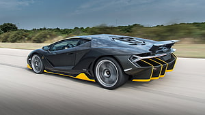 Lamborghini Centenario in Motion on Open Road with Yellow Accents HD wallpaper