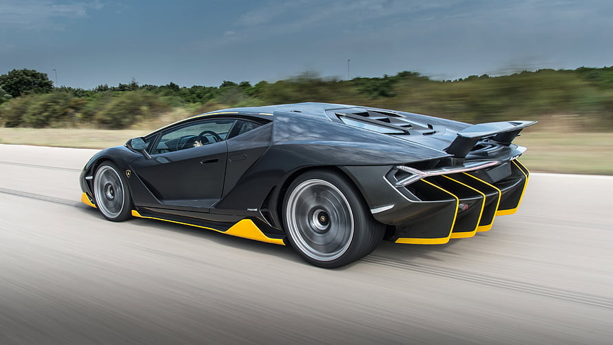 Lamborghini Centenario in Motion on Open Road with Yellow Accents HD wallpaper