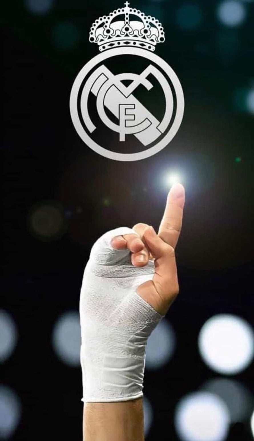 Karim Benzema Pointing Up With Real Madrid Crest Against Dark Stadium Background HD phone wallpaper