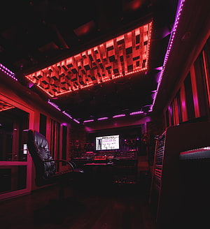 Moody Music Production Studio with Red and Purple Neon Lighting and Mixing Console HD phone wallpaper