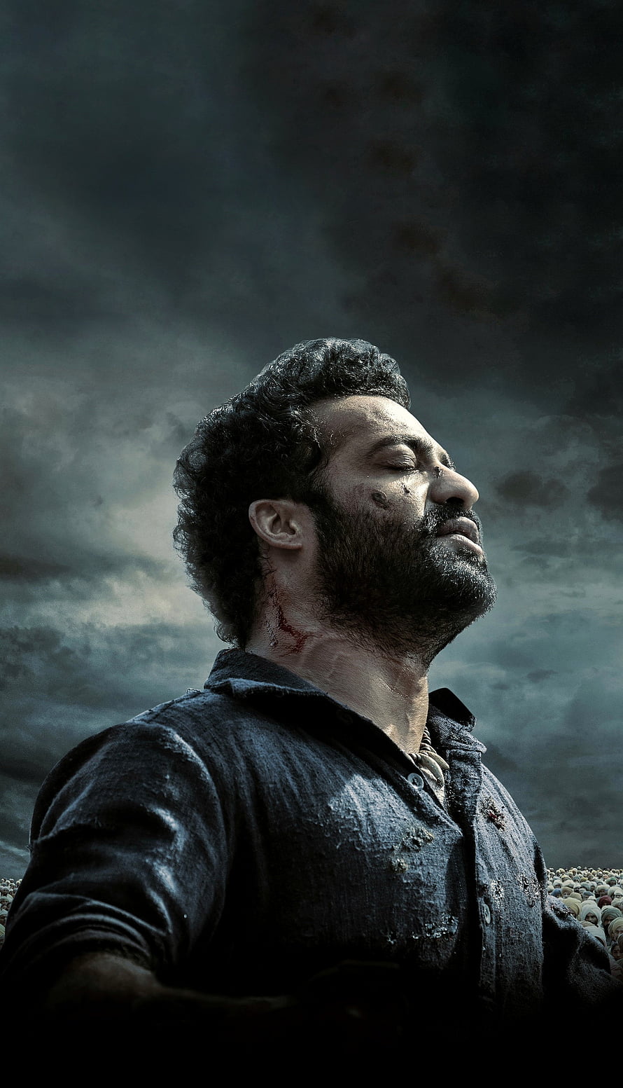 RRR Movie Poster Featuring NTR in Dramatic Stormy Sky Portrait HD phone wallpaper