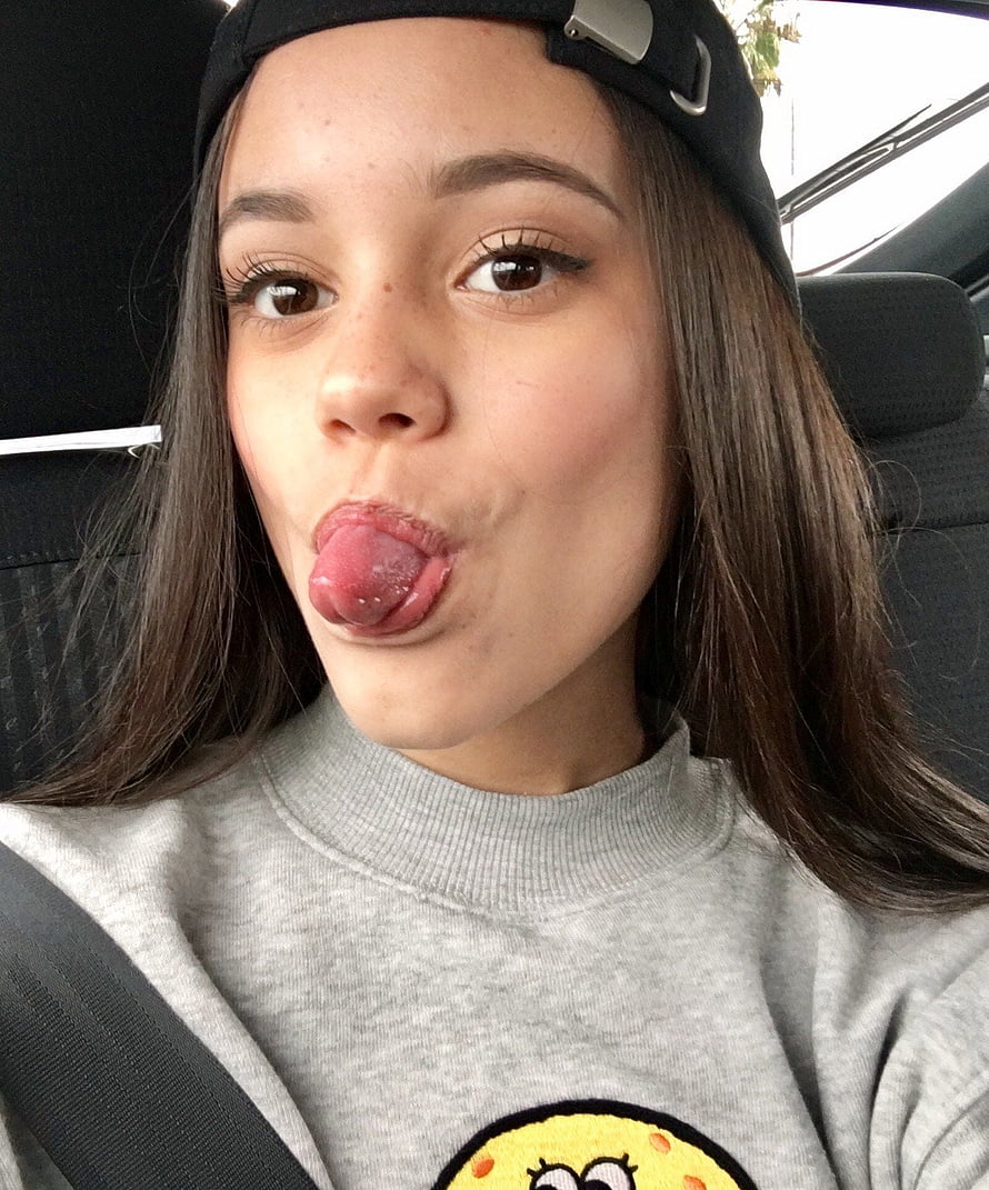 Jenna Ortega Playful Selfie in Car Wearing Backward Cap and Grey Sweatshirt HD phone wallpaper