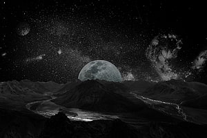 Monochrome Alien Landscape with Giant Moon and Spiral Galaxy Rising Over Dark Mountains HD wallpaper