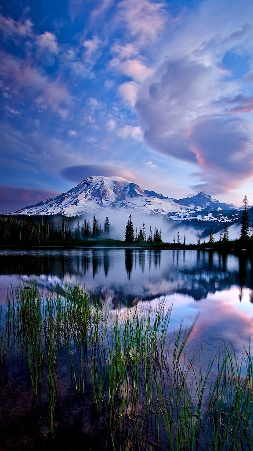 Snow-Capped Mountain Peak Reflected in a Calm Lake at Dusk with Dramatic Clouds HD phone wallpaper