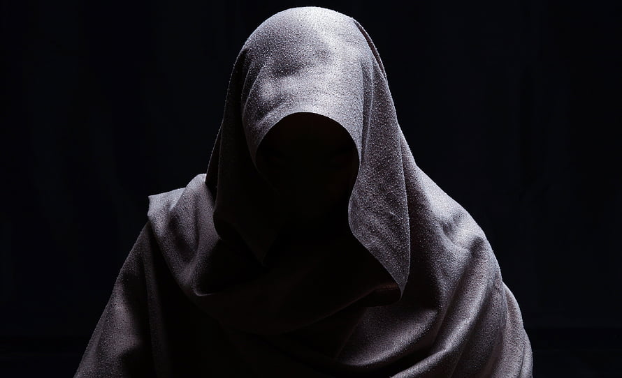 Mysterious hooded figure in shadow with dramatic low-key lighting HD wallpaper