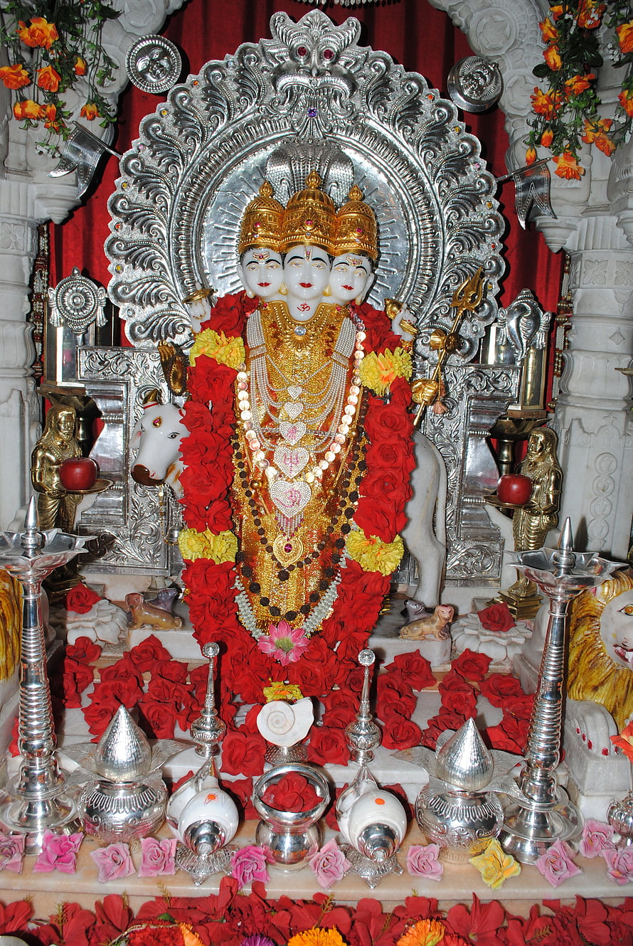 Dattatreya Murti Adorned With Red Rose Garlands And Silver Temple Decorations HD phone wallpaper