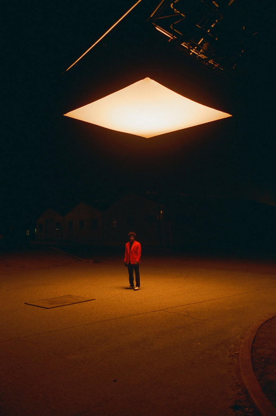 The Weeknd in red jacket under warm spotlight in After Hours album artwork HD phone wallpaper