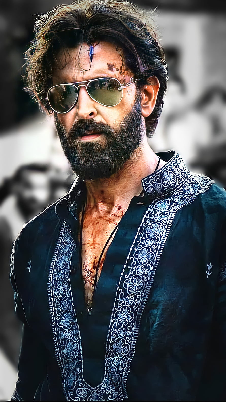 Hrithik Roshan as Vikram in intense action scene with aviator sunglasses and embroidered shirt HD phone wallpaper