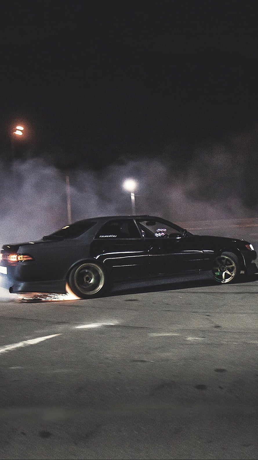 Black Toyota Mark 2 JZX90 Drifting at Night with Tire Smoke in Parking Lot HD phone wallpaper