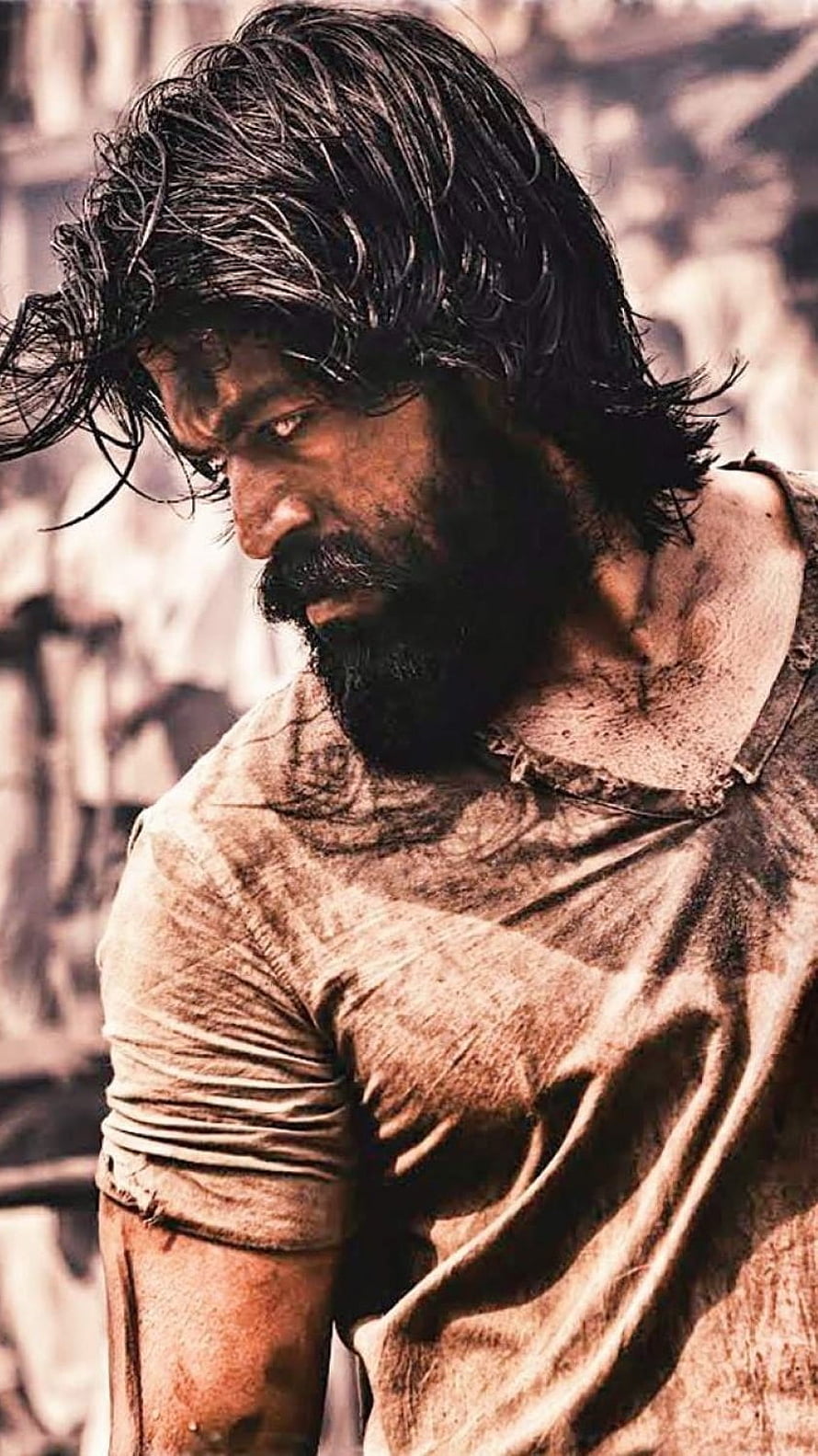 Yash Intense Portrait in KGF Character with Windblown Hair and Weathered Expression HD phone wallpaper