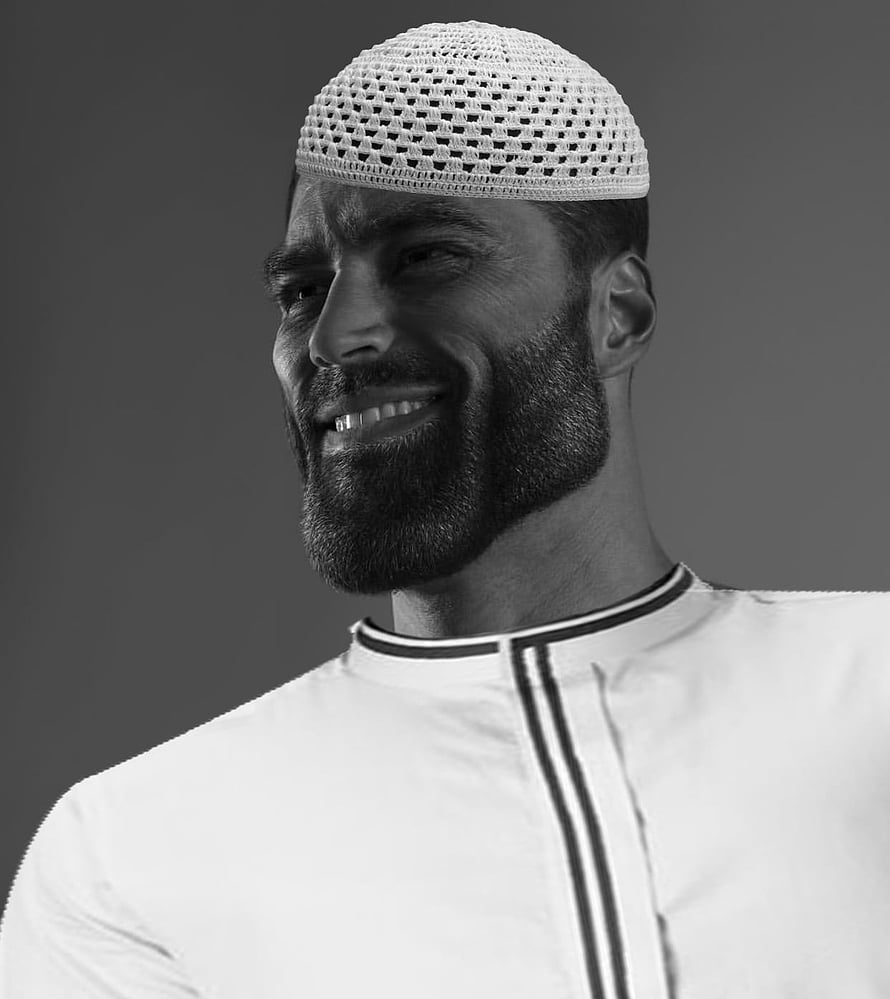 Black and white portrait of a smiling bearded man wearing a traditional kufi cap and thobe HD phone wallpaper