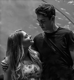 Black and White Portrait of a Young Couple Sharing an Intimate Moment HD phone wallpaper