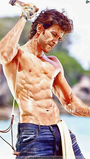 Hrithik Roshan shirtless action pose with whip on a tropical beach HD phone wallpaper