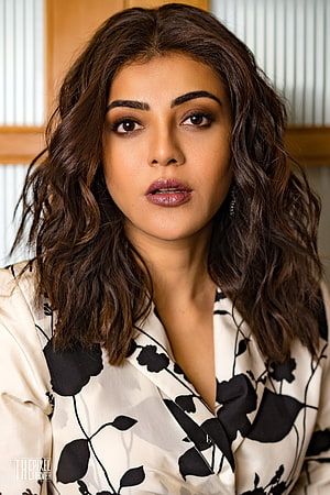 Kajal Agarwal Portrait in Floral Blouse with Wavy Hair and Bold Makeup HD phone wallpaper