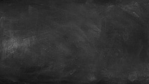 Dark Textured Chalkboard Surface with Faint Eraser Marks and Subtle Grunge Details HD wallpaper