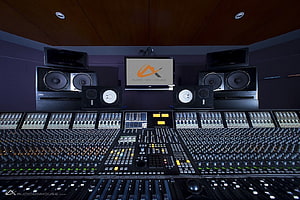 Professional Audio Recording Studio Control Room with Mixing Console and Monitor Speakers HD wallpaper