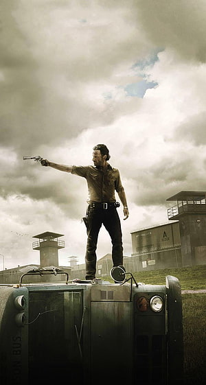 Rick Grimes Standing on Prison Bus Aiming Revolver in The Walking Dead HD phone wallpaper