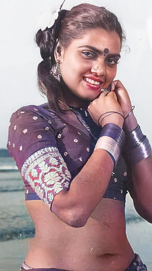 Silk Smitha in Traditional Attire with Floral Blouse and Silver Bangles HD phone wallpaper