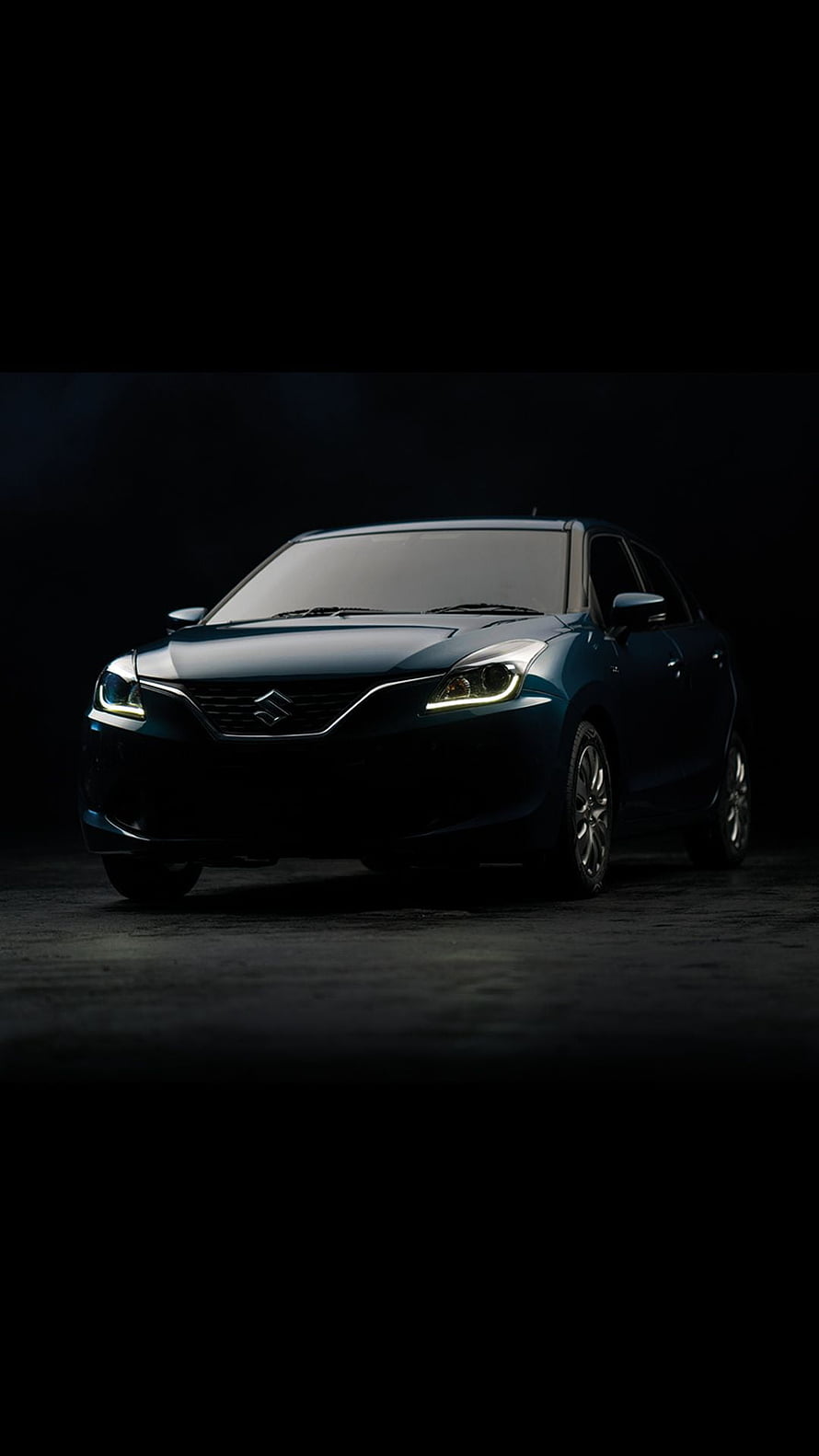 Maruti Suzuki Baleno Sedan in Dark Studio Setting with Dramatic Lighting HD phone wallpaper