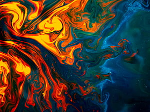 Vibrant Liquid Abstract Art with Swirling Orange and Blue Paint Patterns HD wallpaper