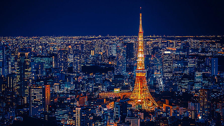 Tokyo Tower Illuminated Against the Night Sky Over the City Skyline HD wallpaper
