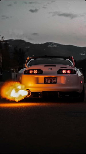 White Toyota Supra MK4 Rear View with Exhaust Flame at Dusk HD phone wallpaper
