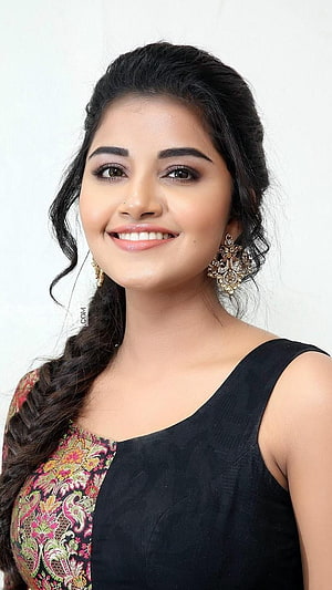 Anupama Parameswaran Portrait in Black and Floral Saree with Gold Earrings HD phone wallpaper