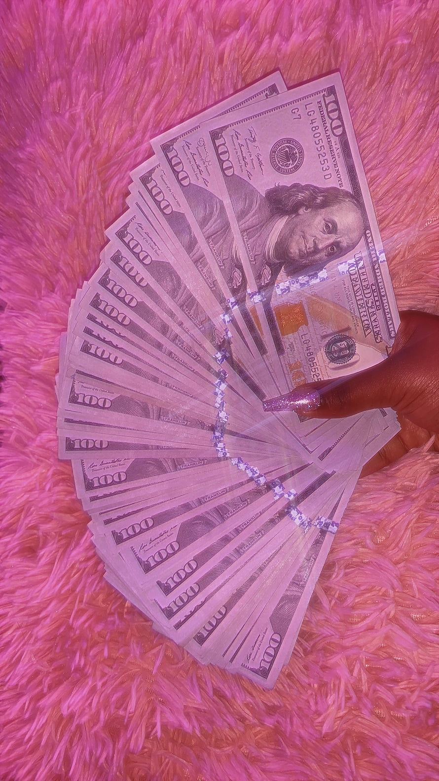 Hand Fanning US One Hundred Dollar Bills on Pink Faux Fur Background HD phone wallpaper