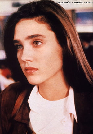 Jennifer Connelly Close-Up Portrait with Long Dark Hair and Contemplative Expression HD phone wallpaper