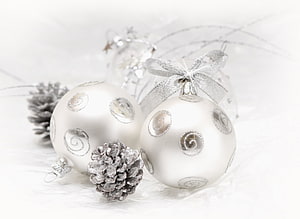 Elegant White Christmas Ornaments with Silver Swirls and Frosted Pinecones HD wallpaper