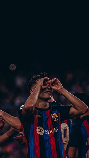 Pedri FC Barcelona Player Celebrating with Hands Over Eyes in Striped Kit HD phone wallpaper