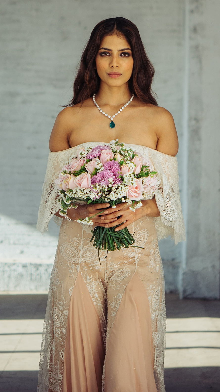 Malavika Mohanan in Elegant Off-Shoulder Bridal Gown Holding Pink Bouquet HD phone wallpaper