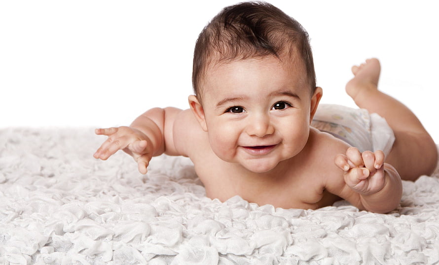 Smiling Indian Baby Lying On White Textured Blanket HD wallpaper