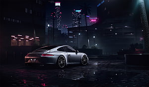 Silver Porsche 911 Carrera S parked on wet cobblestones in a neon-lit city at night HD wallpaper