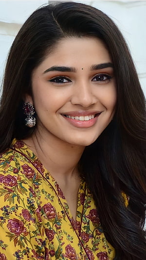Krithi Shetty Portrait in Yellow Floral Kurta with Traditional Earrings HD phone wallpaper